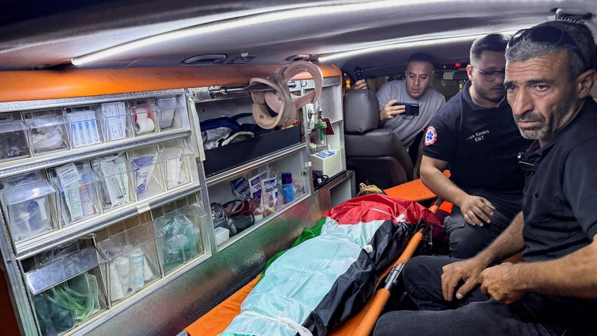 SENSITIVE MATERIAL. THIS IMAGE MAY OFFEND OR DISTURB. Mourners react near the body of 19-year-old Palestinian Omar Naasan, who was killed during a militant settlers' attack, in a hospital in Ramallah in the Israeli-occupied West Bank, September 2, 20