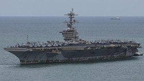 Personnel and aircraft on the deck of the U.S. Navy Nimitz-class aircraft carrier USS Abraham Lincoln as it docks at Laem Chabang Port for a rest stop following a long deployment in the Middle East, in Chonburi province, Thailand, September 3, 2026.