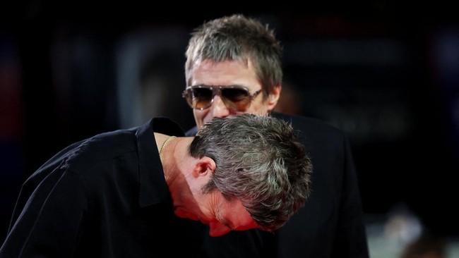 Liam Gallagher and Noel Gallagher pose on the red carpet during arrivals for the screening of the film