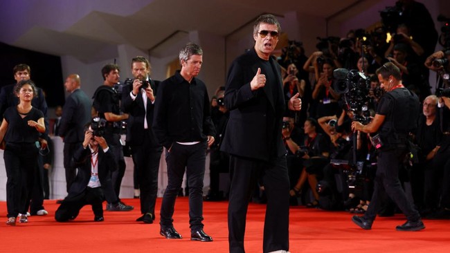 Liam Gallagher and Noel Gallagher pose on the red carpet during arrivals for the screening of the film