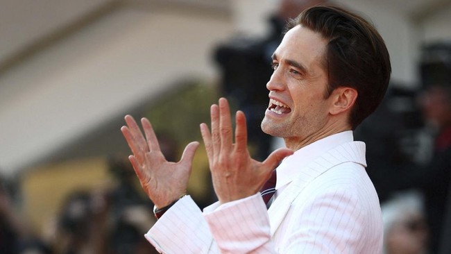 Cast member Robert Pattinson poses on the red carpet during arrivals for the screening of the movie