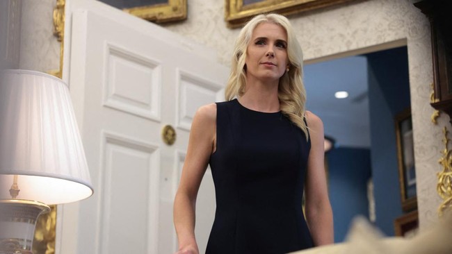 U.S. President Donald Trump's executive assistant Natalie Harp looks on as U.S. President Donald Trump holds an event to deliver remarks on his administration's healthcare policies in the Oval Office at the White House in Washington, D.C., U.S., Augu