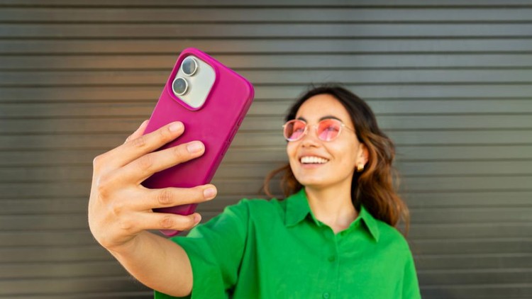 Smiling woman taking a selfie&comma; sharing lifestyle content on social media
