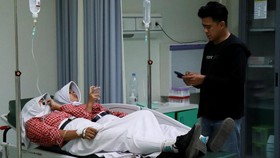 Students rest while receiving treatment for food poisoning at the regional general hospital after eating government-sponsored free school meals in Pati, Central Java province, Indonesia, September 9, 2026. REUTERS/Ragil Kuswanto