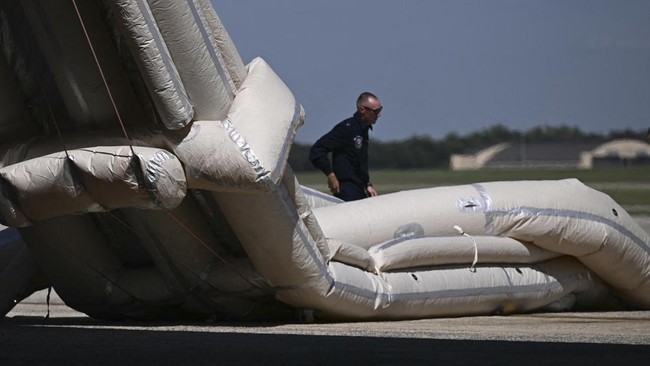 The emergency slide of the new Air Force One is deployed ahead of US President Donald Trumps departure for the Republican National Committee (RNC) midterm convention, at Joint Base Andrews in Maryland on September 9, 2026. Trump is traveling to Dalla