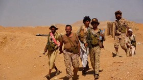 Members of the Saudi-backed Yemeni government forces walk during what they say to be clashes with Yemen's Iran-aligned Houthisin a location given as near Al-Hazm, Yemen, in this screen grab obtained from a handout video released September 9, 2026. Me