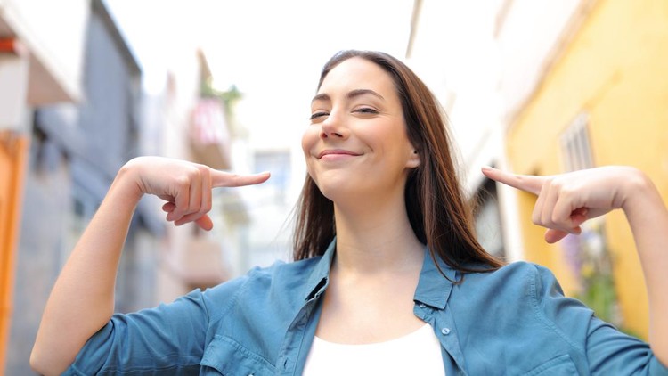 Proud woman pointing herself in the street