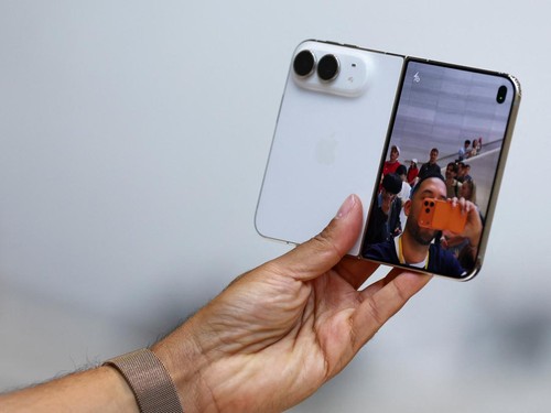 A person holds the new foldable iPhone Duo during Apple's event at the Steve Jobs Theater in Cupertino, California, U.S. September 9, 2026. REUTERS/Carlos Barria