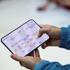 A person holds the new foldable iPhone Duo during Apple's event at the Steve Jobs Theater in Cupertino, California, U.S. September 9, 2026. REUTERS/Carlos Barria