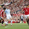 Soccer Football - Premier League - Manchester United v Manchester City - Old Trafford, Manchester, Britain - September 13, 2026 Manchester City's Erling Haaland in action with Manchester United's Lisandro Martinez, Harry Maguire and Youri Tielemans A