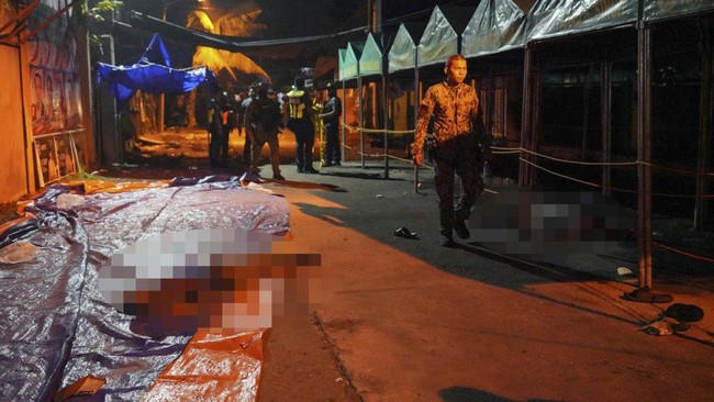 EDITORS NOTE: Graphic content / A body is pictured at the scene of a shooting incident outside a polling station in Cotabato City early on September 14, 2026, ahead of the first election to be held in the Bangsamoro Autonomous Region in Muslim Mindan