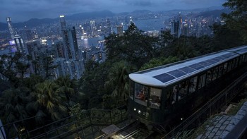 A Peak Tram car ascends towards Victoria Peak with the Hong Kong skyline in the background in Hong Kong, China, August 13, 2026. REUTERS/Tyrone Siu