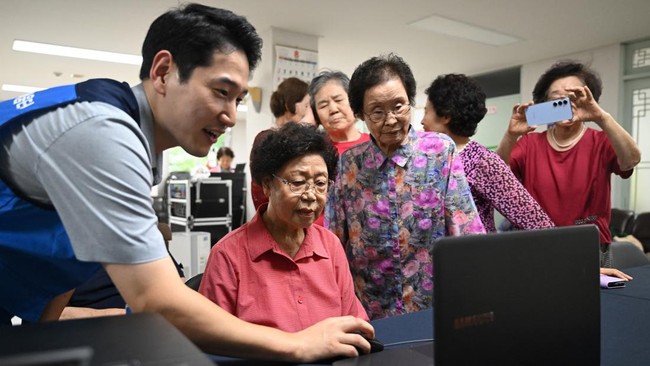 This picture taken on August 13, 2026 shows elderly people attending a government-organised digital survival training at a senior community centre in Suwon. Age gaps in digital literacy are a global concern, yet the gulf has widened massively in the