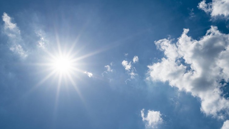 Sun on blue sky with clouds&period;