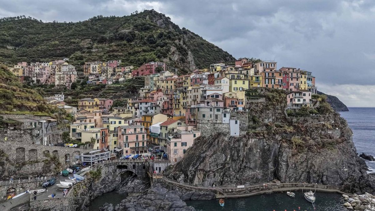 A drone view shows the coastal village of Manarola, part of the Cinque Terre, in Liguria, Italy, September 8, 2026. REUTERS/Ilan Rosenberg