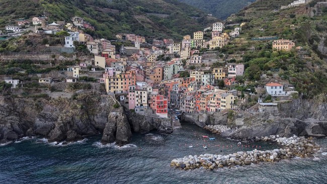 A drone view shows the coastal village of Riomaggiore, part of the Cinque Terre, in Liguria, Italy, September 8, 2026. REUTERS/Ilan Rosenberg