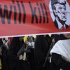Female members of Iranian militia forces (Basij) carry a banner against U.S. President Donald Trump during a military march in Tehran, Iran, September 18, 2026. Majid Asgaripour/WANA (West Asia News Agency) via REUTERS ATTENTION EDITORS - THIS PICTUR
