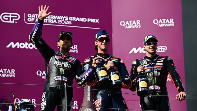MotoGP - Austrian Grand Prix - Red Bull Ring, Spielberg, Austria - September 20, 2026 Red Bull KTM Factory Racing's Pedro Acosta celebrates with champagne on the podium after winning the MotoGP race with second placed Aprilia Racing's Jorge Martin an