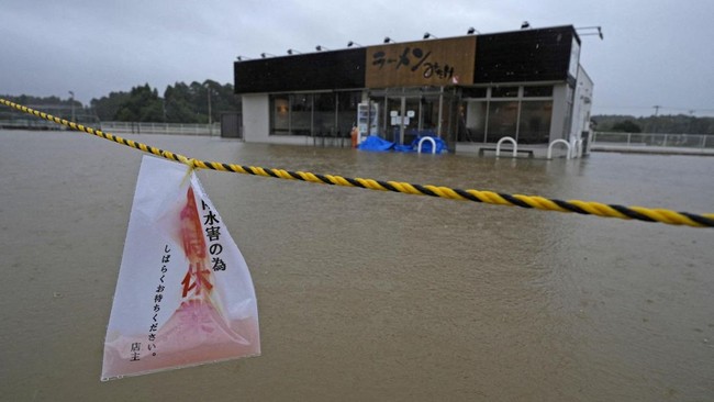 The area around a ramen restaurant is flooded by heavy rain as Typhoon Dujuan approaches, in Oamishirasato, Chiba Prefecture, Japan, September 21, 2026, in this photo taken by Kyodo. Kyodo/via REUTERS ATTENTION EDITORS - THIS IMAGE HAS BEEN SUPPLIED 