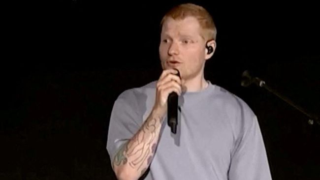 Singer Ed Sheeran speaks on stage as he addresses a controversy over Macklemore being pulled from the tour after saying "Free Palestine" at a show early this month, in Philadelphia, Pennsylvania, US September 19, 2026, in this screen grab obtained fr