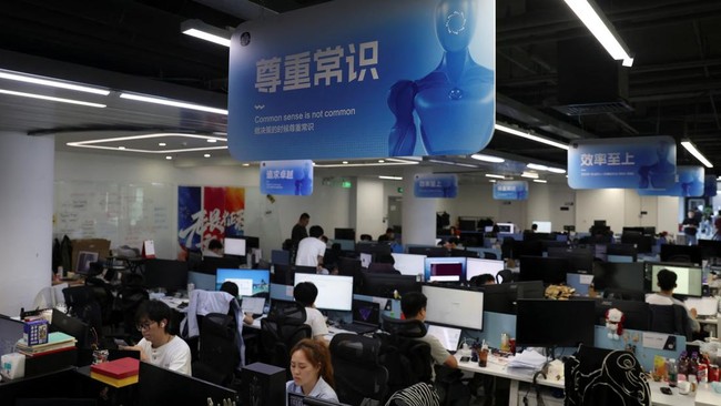 Employees work at the headquarters of Spirit AI in Beijing, China, September 17, 2026. REUTERS/Tingshu Wang