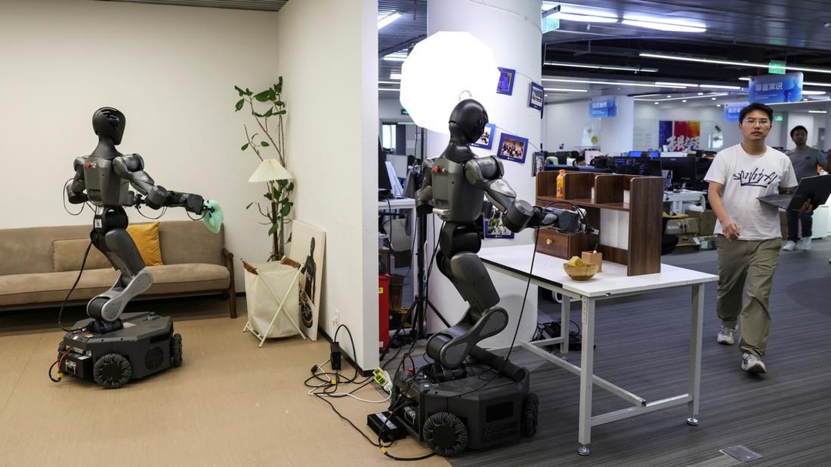 An employee walks past a demonstration area for Moz1 robots, at the headquarters of Spirit AI in Beijing, China, September 17, 2026. REUTERS/Tingshu Wang