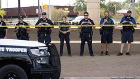 Austin police officers face off with protesters (not pictured) after city officials said that a U.S. Immigration and Customs Enforcement (ICE) agent shot a person earlier in the day in Austin, Texas, U.S. September 20, 2026.   REUTERS/Nuri Vallbona