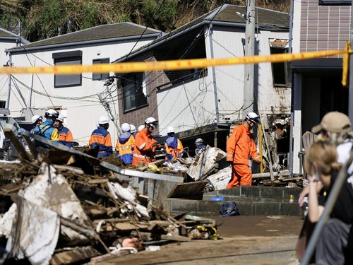 Rescue workers conduct a rescue and search operation for a missing person at a house hit by a landslide triggered by Typhoon Dujuan in Miura, Kanagawa Prefecture, Japan, September 22, 2026, in this photo taken by Kyodo. Mandatory credit Kyodo/via REU