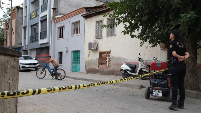 A police officer stand guard at a police cordon near a high school where a gunman opened fire wounding eleven people and was detained shortly afterwards, in Turgutlu, an area west of the resort city of Izmir, on September 22, 2026. A teenager opened