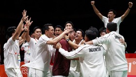 Asian Games - Aichi-Nagoya 2026 - Badminton - Men's Team Final - Gold Medal - Indonesia v China - Ichinomiya City Municipal Gymnasium, Ichinomiya, Japan - September 24, 2026 Indonesia's Moh Zaki Ubaidillah celebrates with teammates after winning his