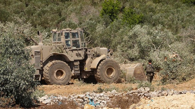 Israeli military machinery uproots olive trees in the Palestinian village of Beit Rima near Ramallah, in the Israeli-occupied West Bank, September 24, 2026. REUTERS/Ali Sawafta