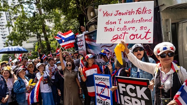 Members of the Network of Students and People for Reform of Thailand (NSPRT) hold placards as they take part in a rally outside the Israeli Embassy in Bangkok on September 10, 2026. A couple of hundred protesters, led by ultranationalist activist Son