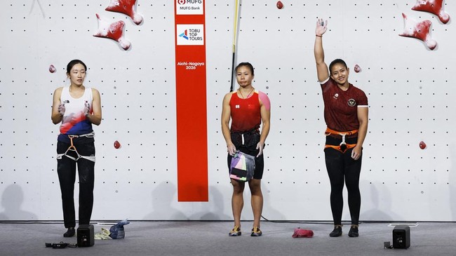 Asian Games - Aichi-Nagoya 2026 - Sport Climbing - Women's Speed 4 - Final - Nagoya International Exhibition Hall, Nagoya, Japan - September 30, 2026 China's Lijuan Deng, South Korea's Jimin Jeong and Indonesia's Desak Made Rita Kusuma Dewi react REU