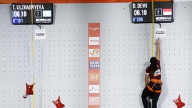 Asian Games - Aichi-Nagoya 2026 - Sport Climbing - Women's Speed 4 - Quarter Final - Nagoya International Exhibition Hall, Nagoya, Japan - September 30, 2026 Kazakhstan's Tamara Ulzhabayeva in action with Indonesia's Desak Made Rita Kusuma Dewi durin