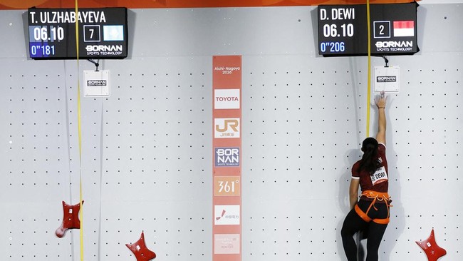 Asian Games - Aichi-Nagoya 2026 - Sport Climbing - Women's Speed 4 - Quarter Final - Nagoya International Exhibition Hall, Nagoya, Japan - September 30, 2026 Kazakhstan's Tamara Ulzhabayeva in action with Indonesia's Desak Made Rita Kusuma Dewi durin