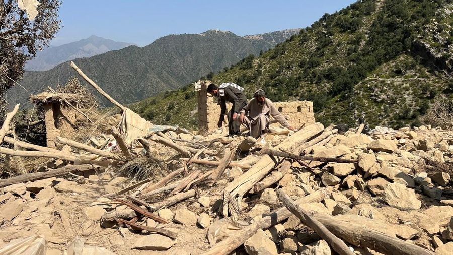 Men salvage their belongings from the debris of a house that was damaged in what the Taliban said was a Pakistani airstrike in Shultan district in Kunar province, Afghanistan, October 1, 2026. REUTERS/Stringer