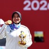 Asian Games - Aichi-Nagoya 2026 - Archery - Okazaki Central Park Multipurpose Square, Okazaki, Japan - October 1, 2026 Gold medallist Indonesia's Nurisa Dian Ashrifah celebrates on the podium during the Compound Women's Individual Victory Ceremony RE