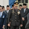 Newly appointed Indonesian National Police Chief General Suyudi Ario Seto (C) walks inside the State Palace during his swearing-in ceremony in Jakarta on October 1, 2026. Indonesian President Prabowo Subianto officially sworn in Seto, former Head of
