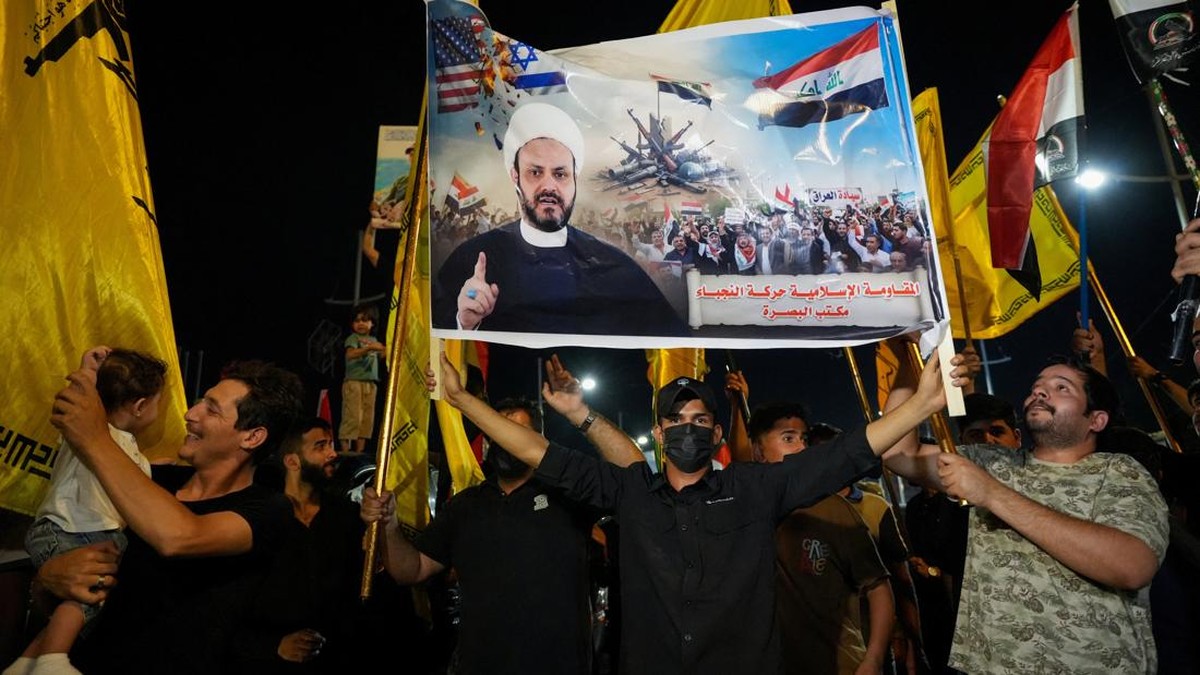 Supporters of a Shi'ite armed group celebrate the withdrawal of US-led coalition forces from Iraq, ending a military presence that began after the 2003 US-led invasion, in Basra, Iraq, September 30, 2026. REUTERS/Essam Al-Sudani
