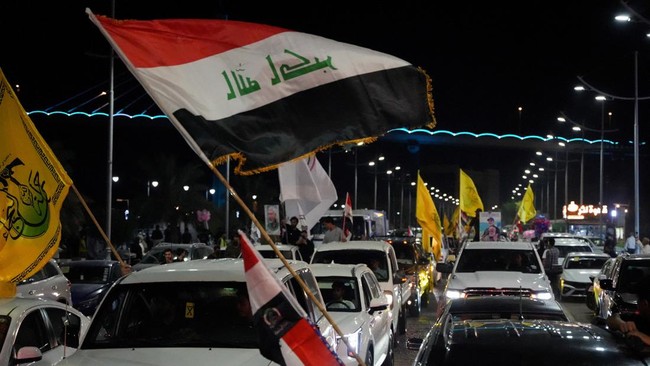 Supporters of a Shi'ite armed group celebrate the withdrawal of US-led coalition forces from Iraq, ending a military presence that began after the 2003 US-led invasion, in Basra, Iraq, September 30, 2026. REUTERS/Essam Al-Sudani