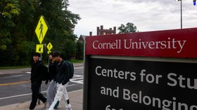ITHACA, NEW YORK - SEPTEMBER 30: Students walk on the campus of Cornell University a day after on September 30, 2026, in Ithaca, New York. A New York state attorney general has announced a review of the schools initial response to allegations from a