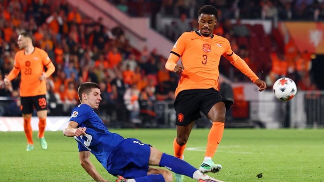Soccer Football - Nations League - Group A2 - Netherlands v Serbia - Philips Stadion, Eindhoven, Netherlands - October 4, 2026 Netherlands' Jorrel Hato in action Serbia's Stefan Gudelj REUTERS/Piroschka Van De Wouw