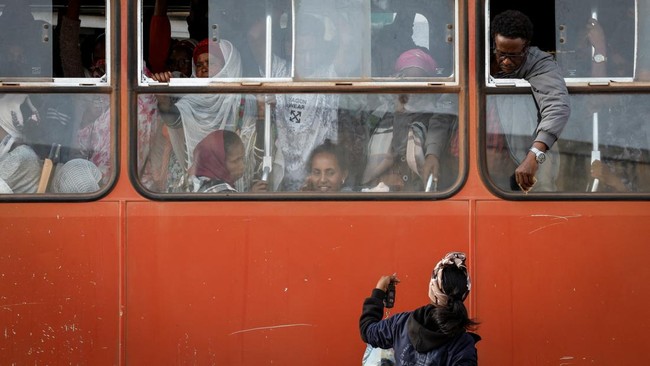 A man inside a bus engages a hawker at a bus stop, in Asmara, Eritrea, June 17, 2026. Eritrea has long been isolated by the West, which views the East African country as among the most repressive in the world, while the government in Asmara has itsel