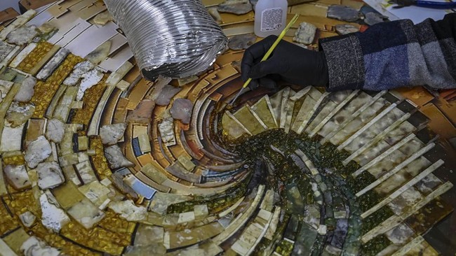 An employee makes amber ornaments and souvenirs at a production facility of the Amber Galbin group in Rivne, northwestern Ukraine on May 20, 2026. Russia's invasion has hit efforts to regulate the industry in Ukraine, which has some of the world's bi