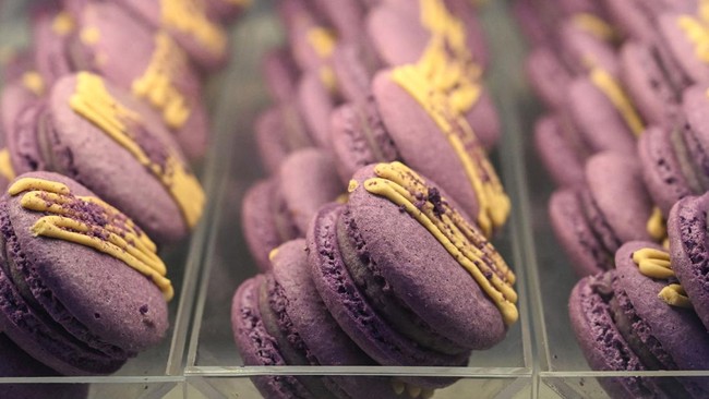 This photo taken on September 23, 2026 shows ube macarons on display during a purple yam promotional event at a mall in Quezon City, Metro Manila. The Philippine ube has become a trend-setting sensation from Los Angeles to London to Seoul, with the h