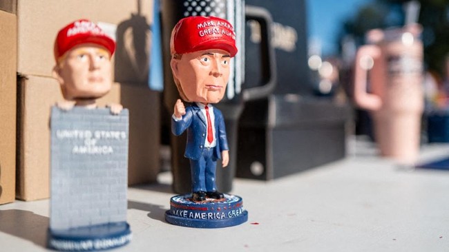 PRAIRIE DU CHIEN, WISCONSIN - SEPTEMBER 27: Merchandise is displayed for sale on a table on September 27, 2024 in Prairie du Chien, Wisconsin. With 39 days remaining, the former president continues rallying supporters and campaigning in battleground 