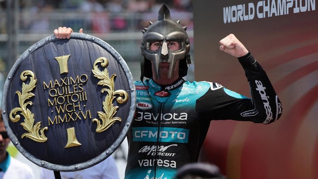 MotoGP - Indonesian Grand Prix - Mandalika International Street Circuit, Mandalika, Indonesia - October 11, 2026 CFMOTO Aspar Team's Maximo Quiles celebrates with a viking's helmet and shield after winning the Moto3 race REUTERS/Willy Kurniawan