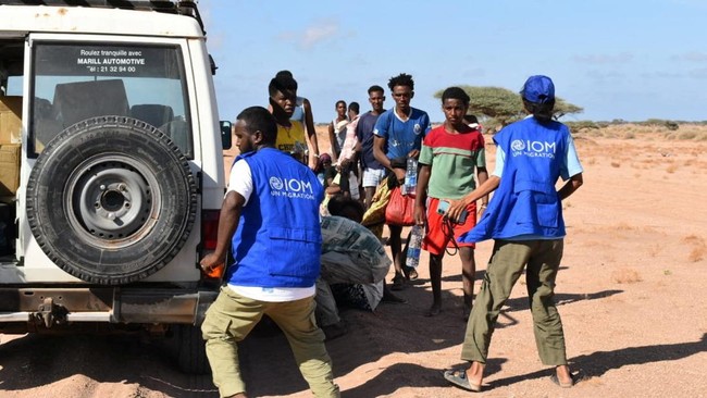 International Organization for Migration workers receive migrants after a boat carrying about 305 people capsized while sailing from Djibouti to Yemen, leaving at least 109 migrants, including 15 children, dead and more than 116 missing, according to