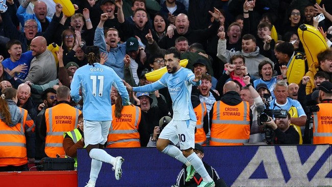 Soccer Football - Premier League - Liverpool v Manchester City - Anfield, Liverpool, Britain - October 11, 2026 Manchester City's Rayan Cherki celebrates scoring their third goal with Jeremy Doku REUTERS/Phil Noble EDITORIAL USE ONLY. NO USE WITH UNA