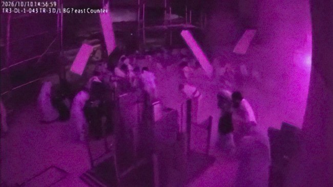 Surveillance footage shows debris falling as people react at the moment of an attack at King Khalid International Airport in Riyadh, Saudi Arabia, October 10, 2026, in this frame from a handout video. Saudi Ministry of Media/Handout via REUTERS    TH